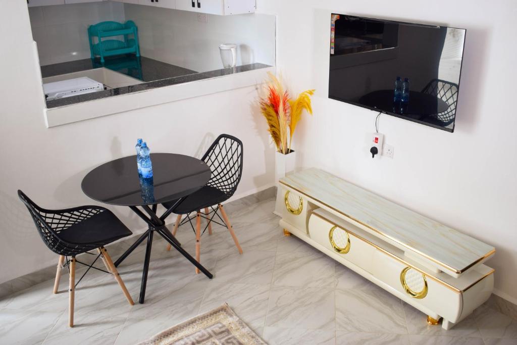 TV a/nebo společenská místnost v ubytování Mzinyi Homes