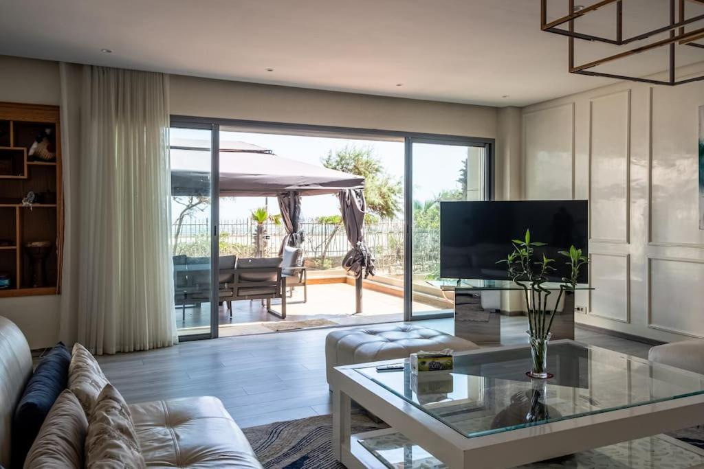 a living room with a couch and a table at Marina Sea View Appartements in Casablanca