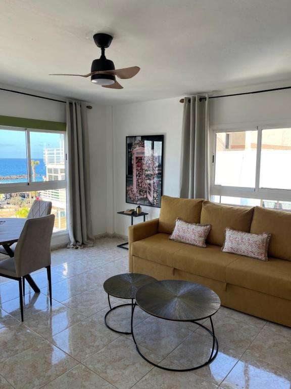 a living room with a couch and a table at CORNELIAS HOME TC3 Atico in Los Cristianos