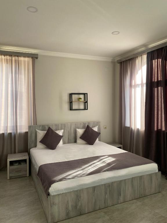 Postel nebo postele na pokoji v ubytování Hotel Menua