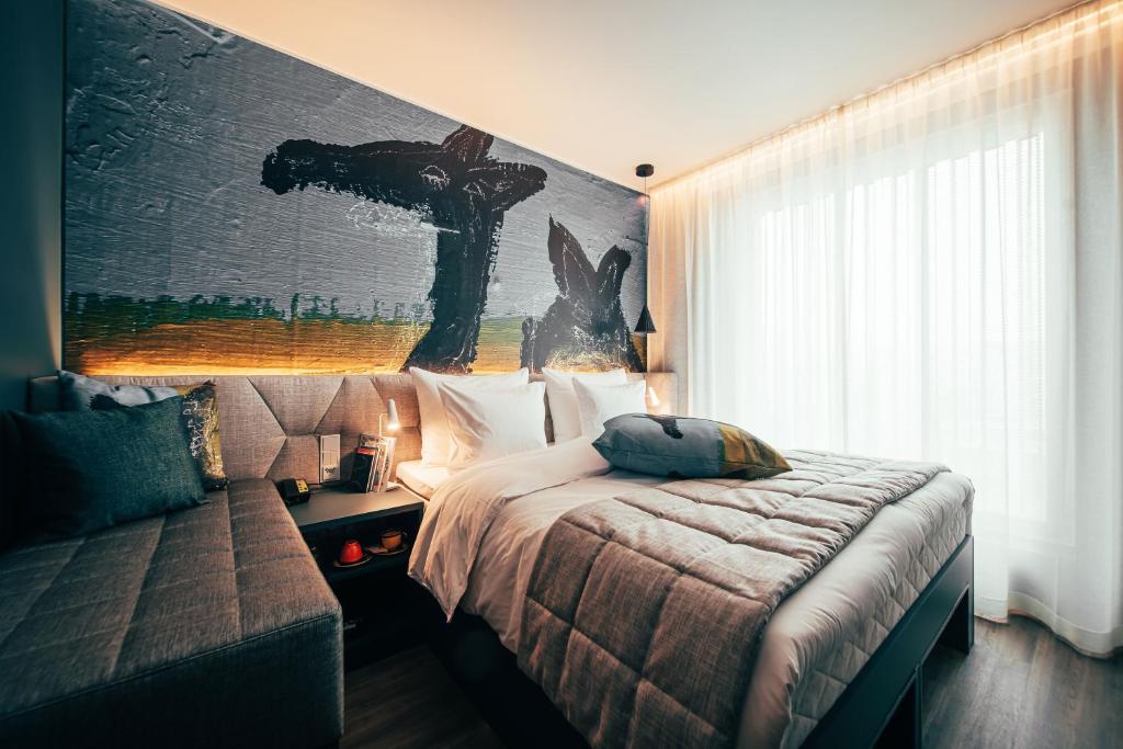 Ένα ή περισσότερα κρεβάτια σε δωμάτιο στο Hotel AX