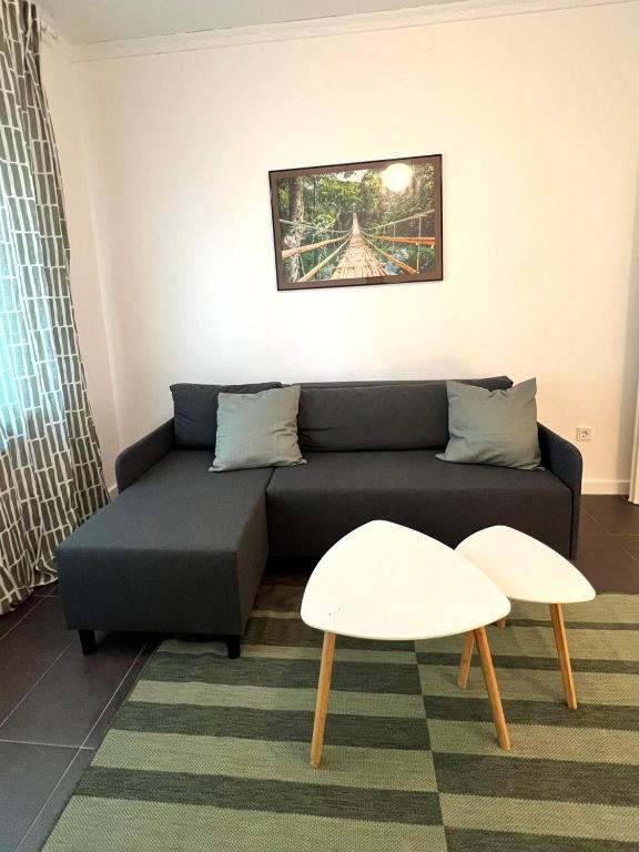 a living room with a couch and a table at Hanse-Vermietung in Bremen