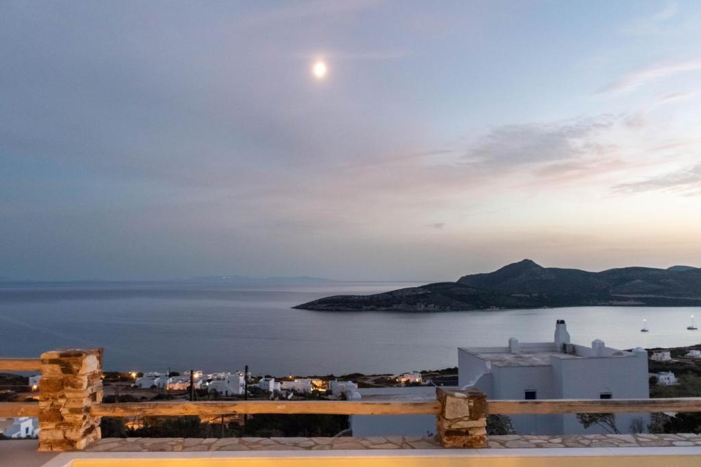 a view of the ocean from a house with the moon overhead at Deja Blue Villa 1 in Agios Georgios