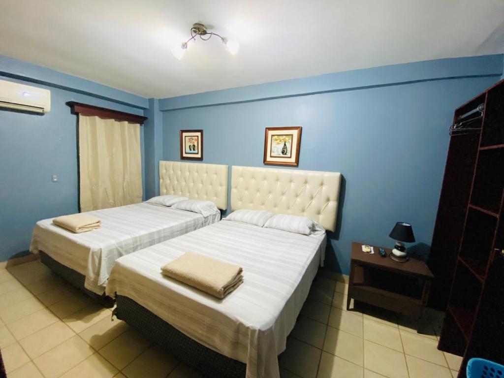 Merendon Suite Apartamento客房内的一张或多张床位