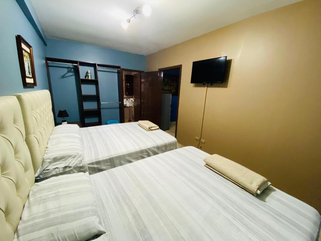 Merendon Suite Apartamento客房内的一张或多张床位