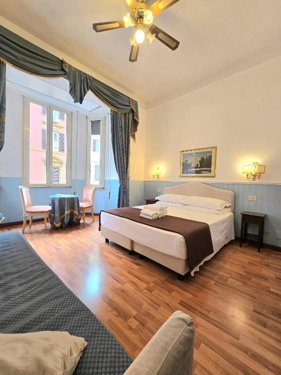 Postel nebo postele na pokoji v ubytování Hotel Porta Pia