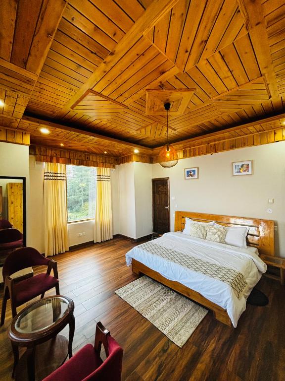 Ένα ή περισσότερα κρεβάτια σε δωμάτιο στο Hilly Horizon BnB Kufri