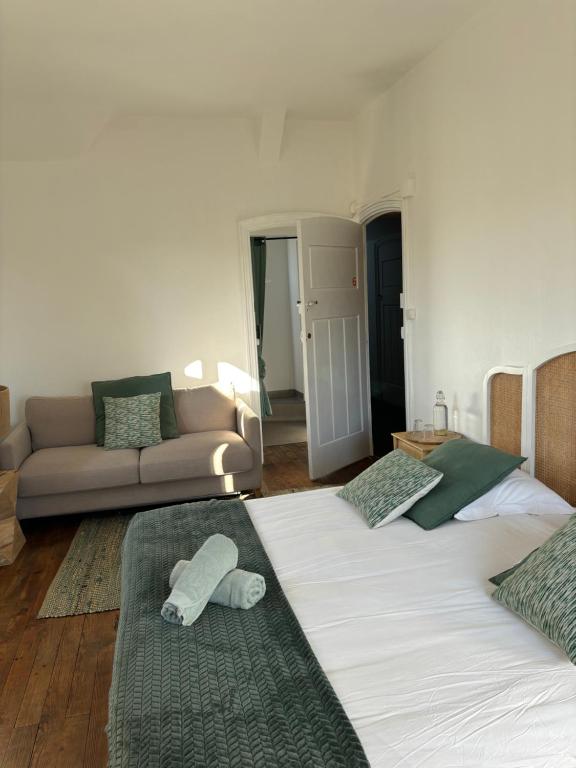 Posteľ alebo postele v izbe v ubytovaní O'Cottage suite Familiale