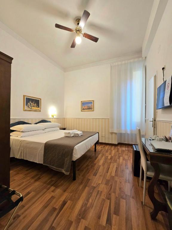 Postel nebo postele na pokoji v ubytování Hotel Porta Pia