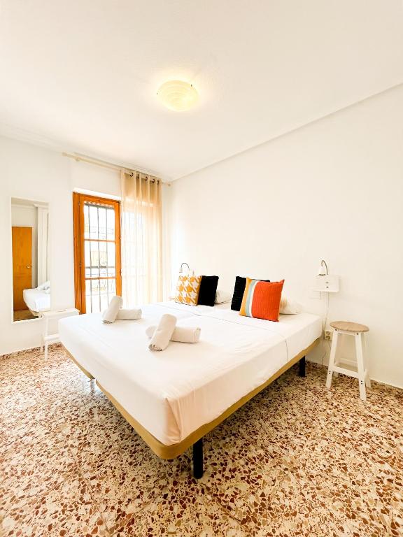 a large white bedroom with a large bed at Stay In Calm Beach in Santa Pola
