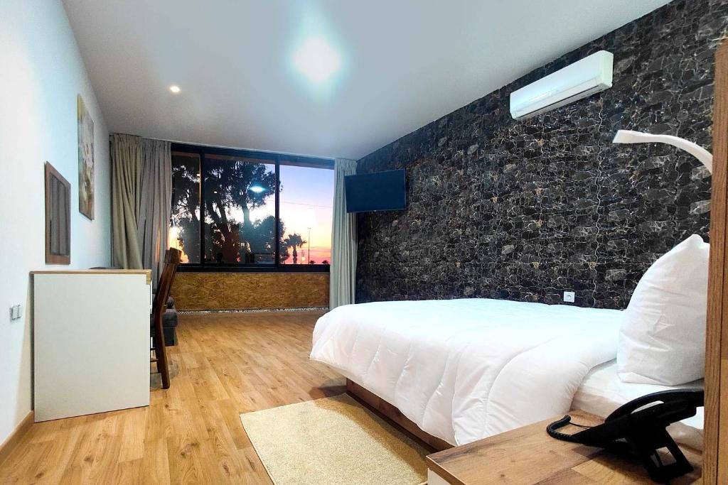Postel nebo postele na pokoji v ubytování Villa Mirasol Hotel