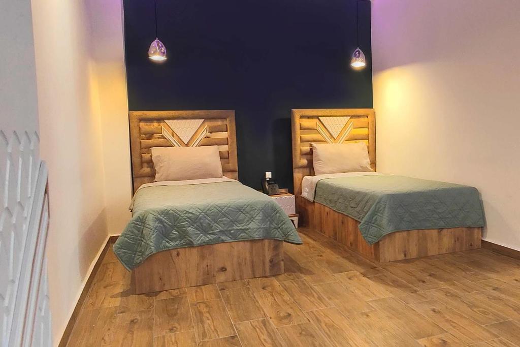 Postel nebo postele na pokoji v ubytování Villa Mirasol Hotel