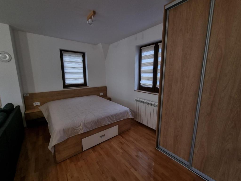 Postel nebo postele na pokoji v ubytování HedoNik Divčibare