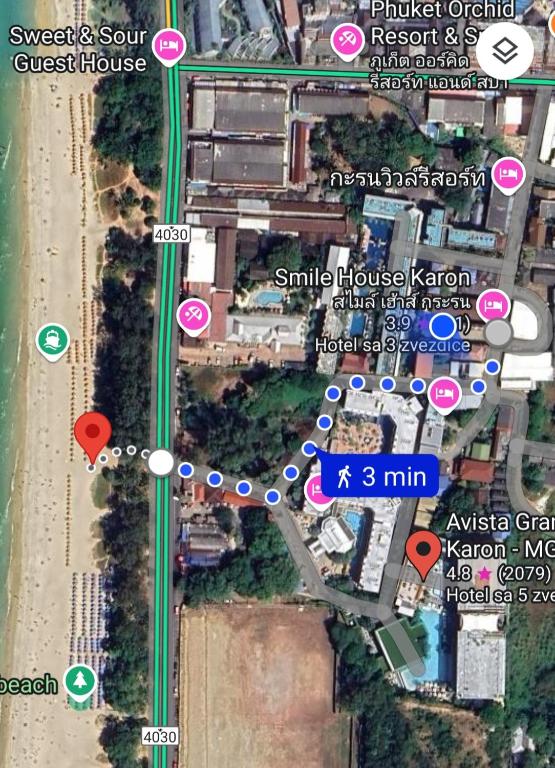 a map of a street with pink and green signs at Smile house in Karon Beach