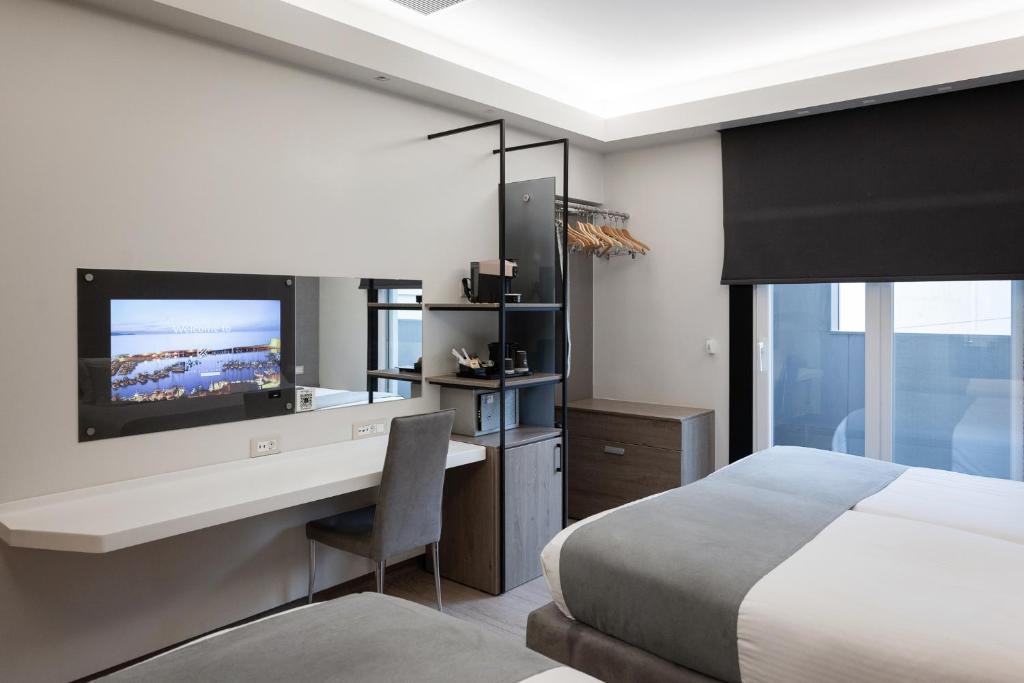 Postel nebo postele na pokoji v ubytování Kastro Hotel