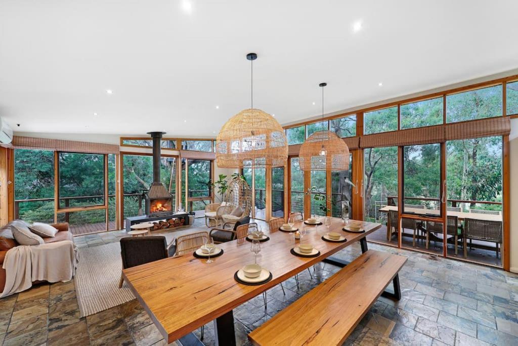 a large living room with a table and chairs at Kurraburra Lodge in Anglesea