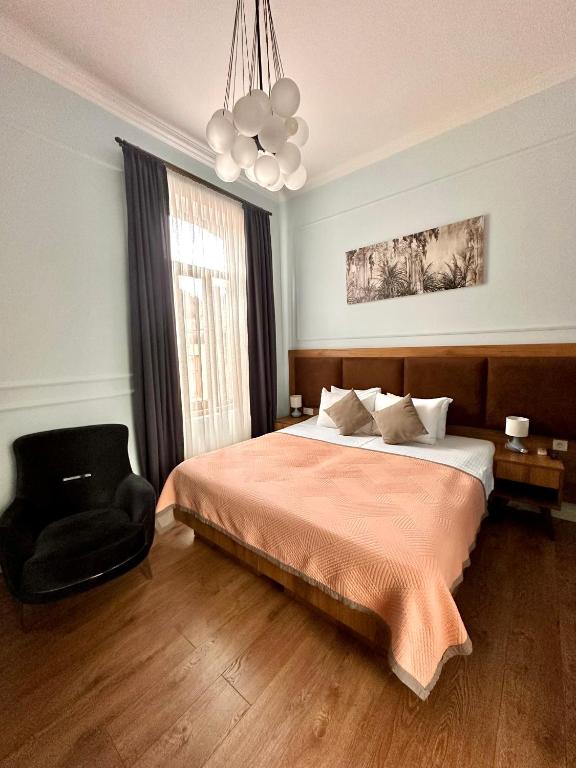 Postel nebo postele na pokoji v ubytování Hotel Wine Time Tbilisi