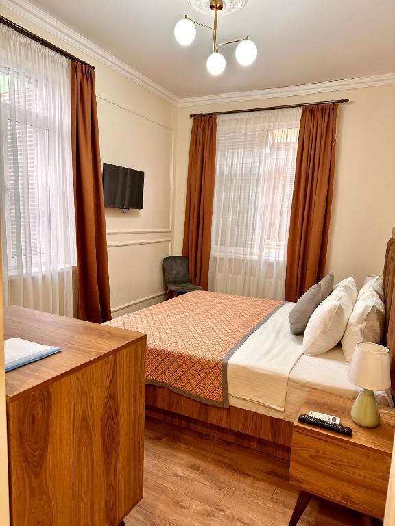 Postel nebo postele na pokoji v ubytování Hotel Wine Time Tbilisi