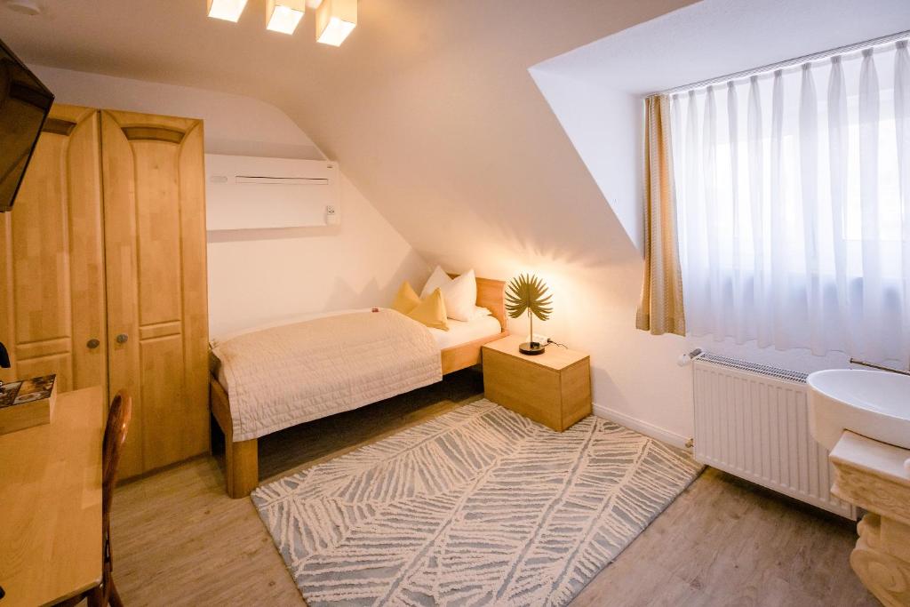 Postel nebo postele na pokoji v ubytování Franconia City Hotel