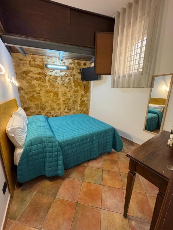 Postel nebo postele na pokoji v ubytování Le Scalette del centro