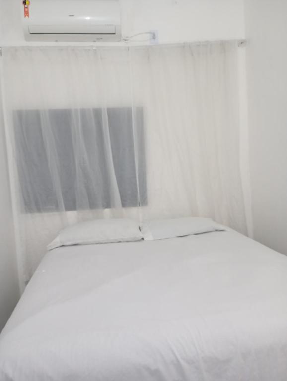 Postel nebo postele na pokoji v ubytování Suíte Casa Central Garagem Hatch