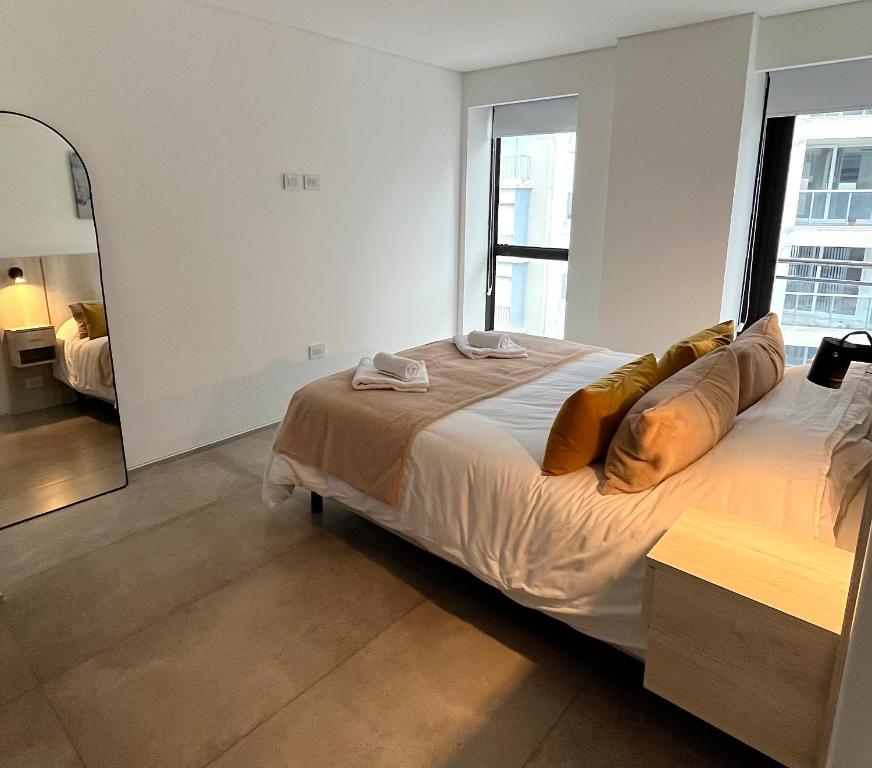 Postel nebo postele na pokoji v ubytování Depto 2 amb PLAYA GRANDE con Cochera - C -