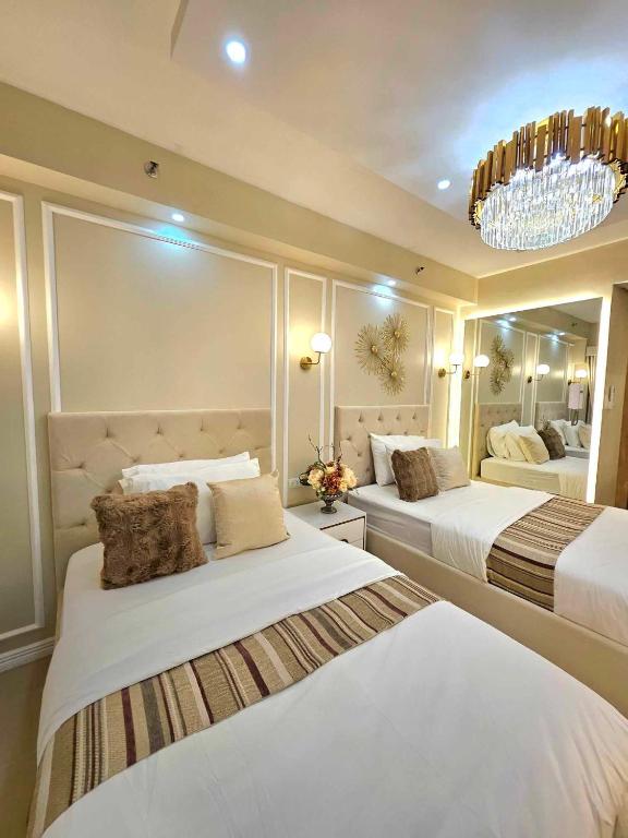 מיטה או מיטות בחדר ב-Jay Suite