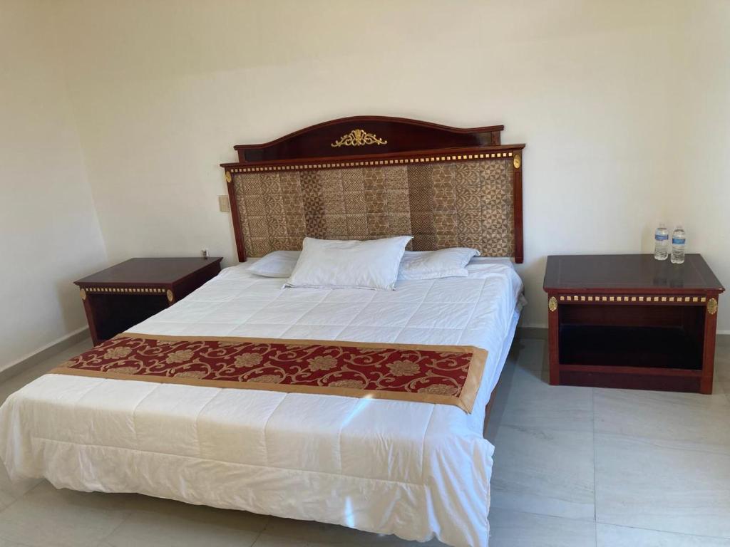 Postel nebo postele na pokoji v ubytování Hotel Mandarin