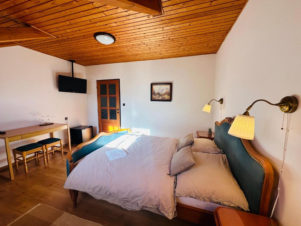 A bed or beds in a room at Penzión Hrubjak