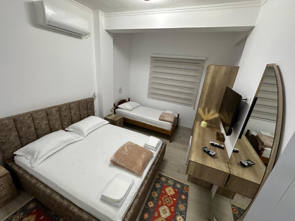 Postel nebo postele na pokoji v ubytování Lola's Rooms