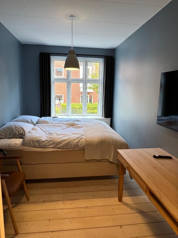 Postel nebo postele na pokoji v ubytování Byhuset Vejle