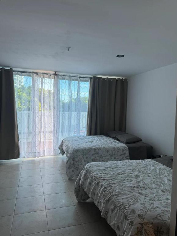 Postel nebo postele na pokoji v ubytování 5 min de la playa - Cómoda suite con piscina
