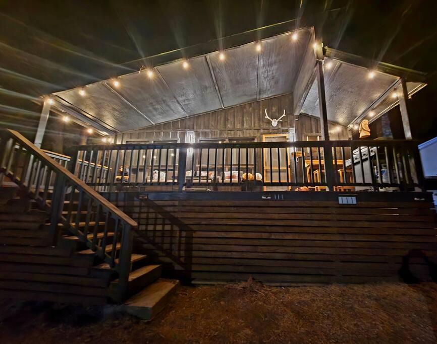 a set of stairs in a building with lights at Cozy mountain cabin close walk to Midtown with AC in Ruidoso