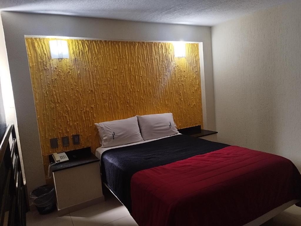 Postel nebo postele na pokoji v ubytování HOTEL MORELOS