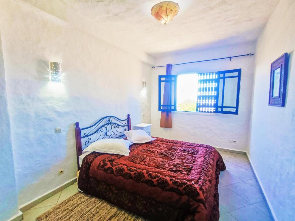 Tempat tidur dalam kamar di P1 duplex vue sur Mer