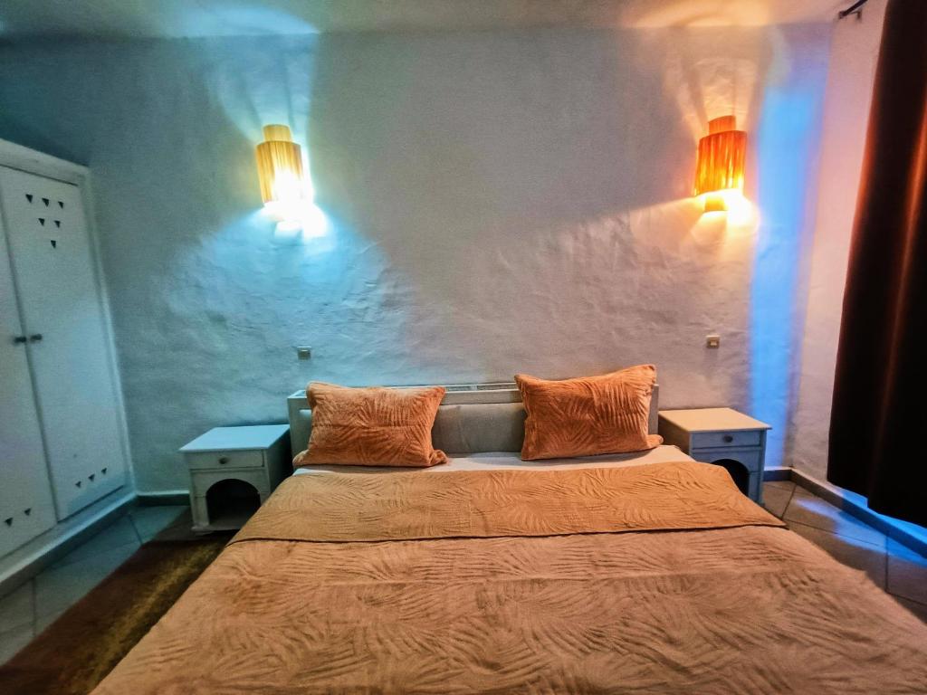 Tempat tidur dalam kamar di P1 duplex vue sur Mer