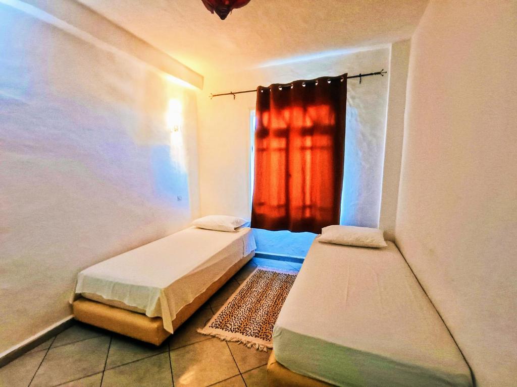 Tempat tidur dalam kamar di P1 duplex vue sur Mer