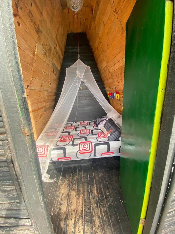 Postelja oz. postelje v sobi nastanitve Tipiland baru la casa del mono