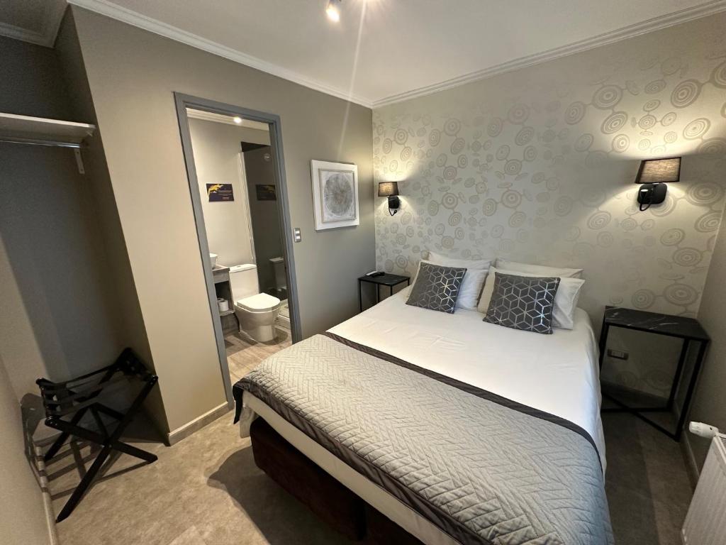 Postel nebo postele na pokoji v ubytování Patagonia Hotel & Apart Suite