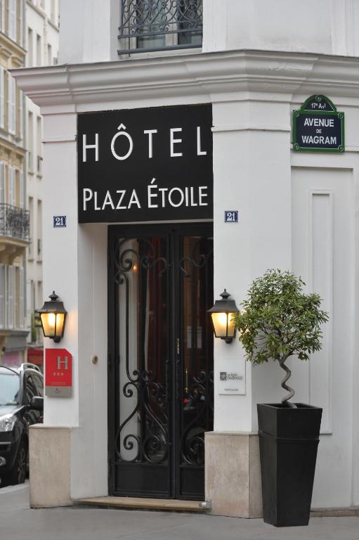 a hotel plaza fluoride sign on the front of a building at Hôtel Plaza Étoile in Paris
