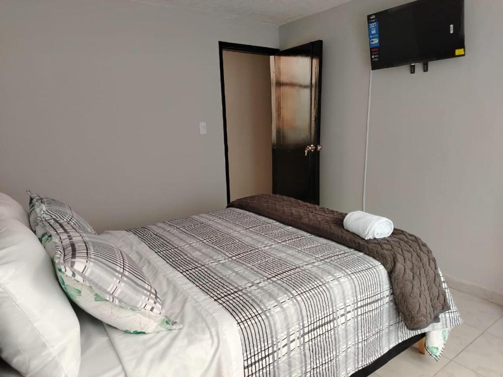 Postel nebo postele na pokoji v ubytování Dos Habitación independientes con Baño compartido