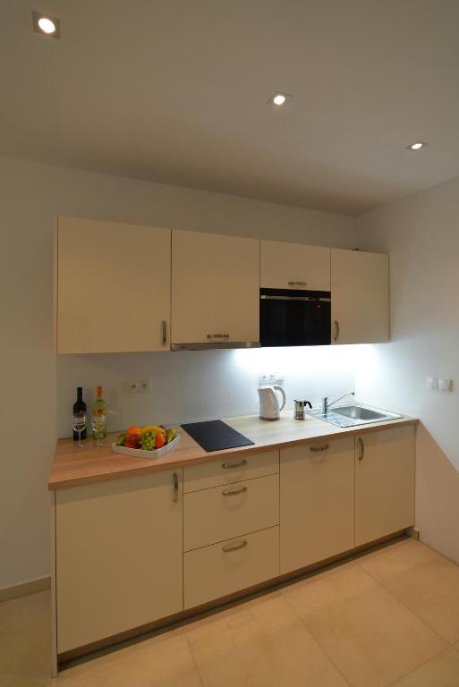 Kuchyň nebo kuchyňský kout v ubytování Apartmány Belveder