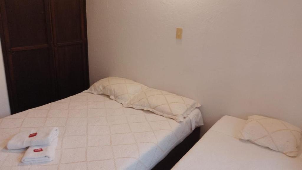 Postel nebo postele na pokoji v ubytování Hostal casa de los sueños