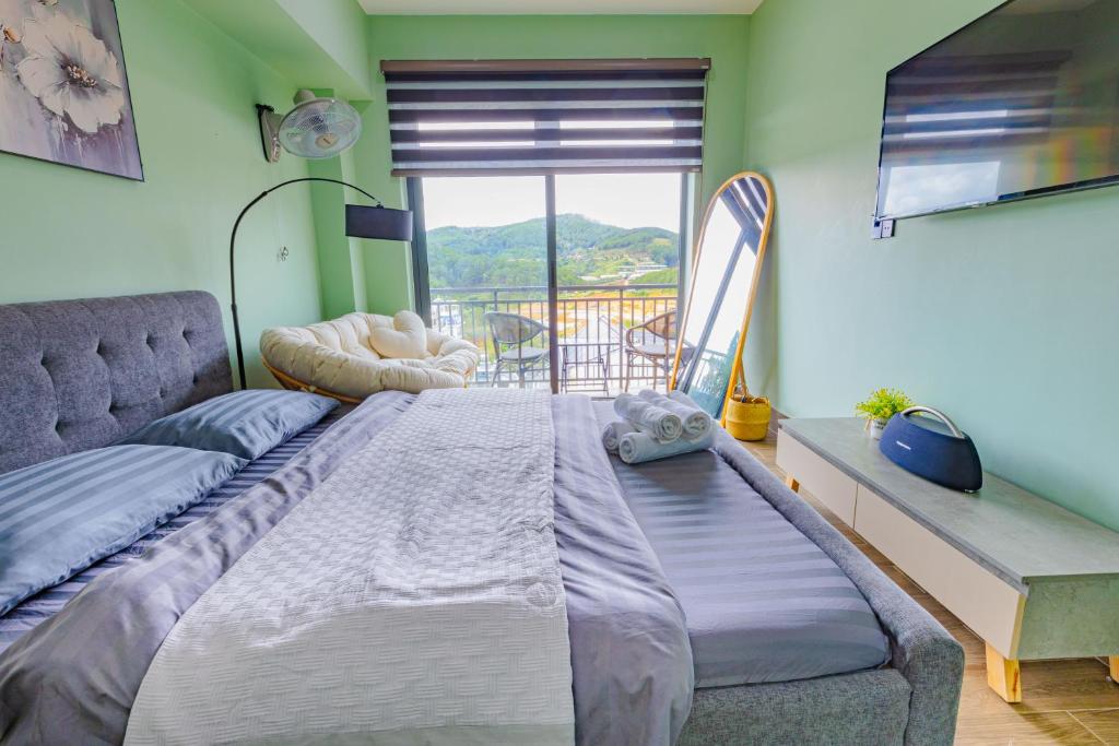 Giường trong phòng chung tại Green House - Căn hộ có bếp riêng