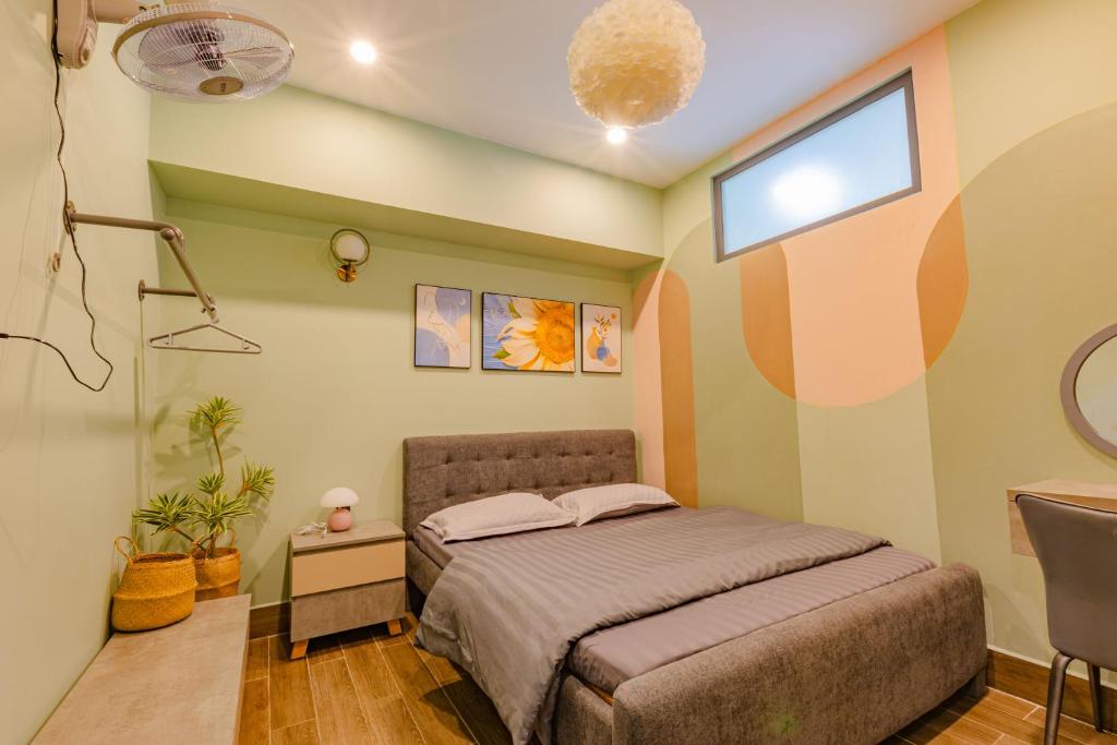 Giường trong phòng chung tại Green House - Căn hộ có bếp riêng