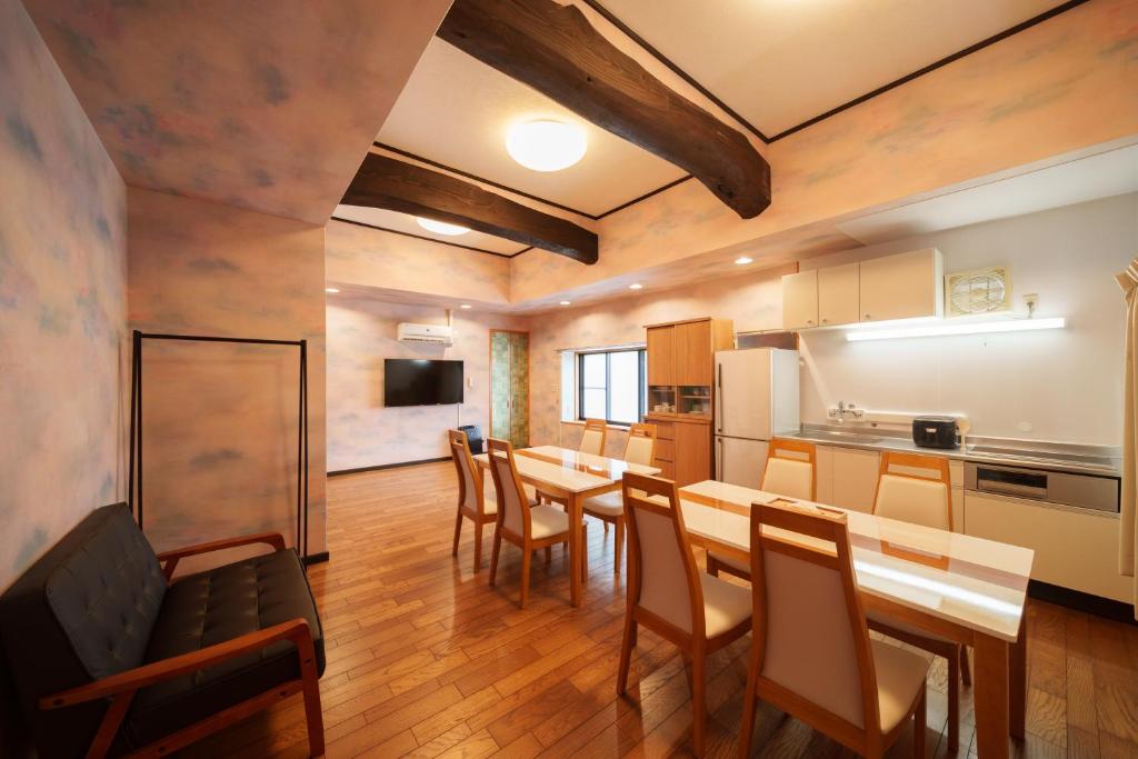 a kitchen and dining room with a table and chairs at 【Newly Opened】Yufuin Geihinkan Kura in Yufuin