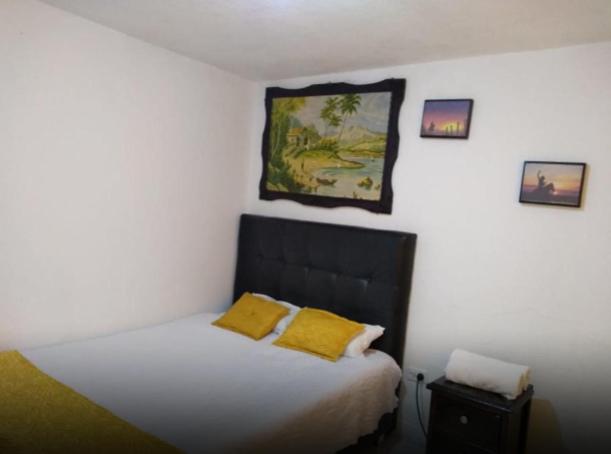 Postel nebo postele na pokoji v ubytování Hotel Casa Nini