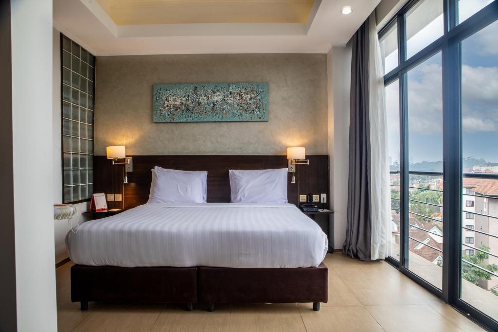 Postel nebo postele na pokoji v ubytování Swiss-Belinn Nairobi