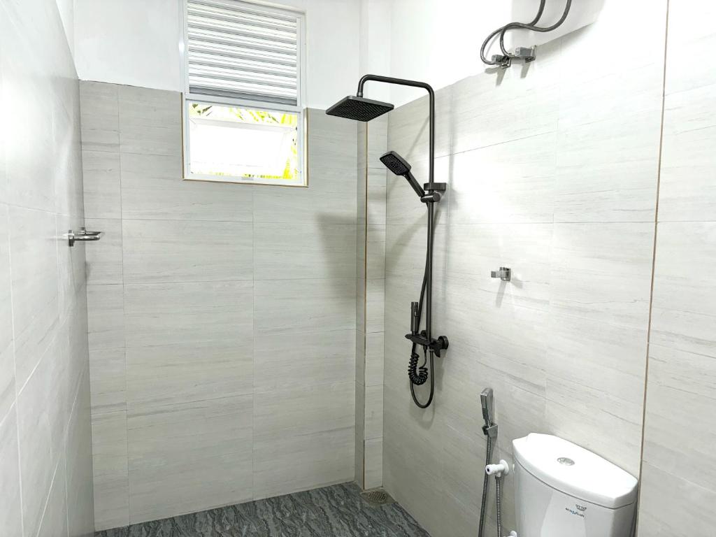Koupelna v ubytování Sandy Palms Guesthouse