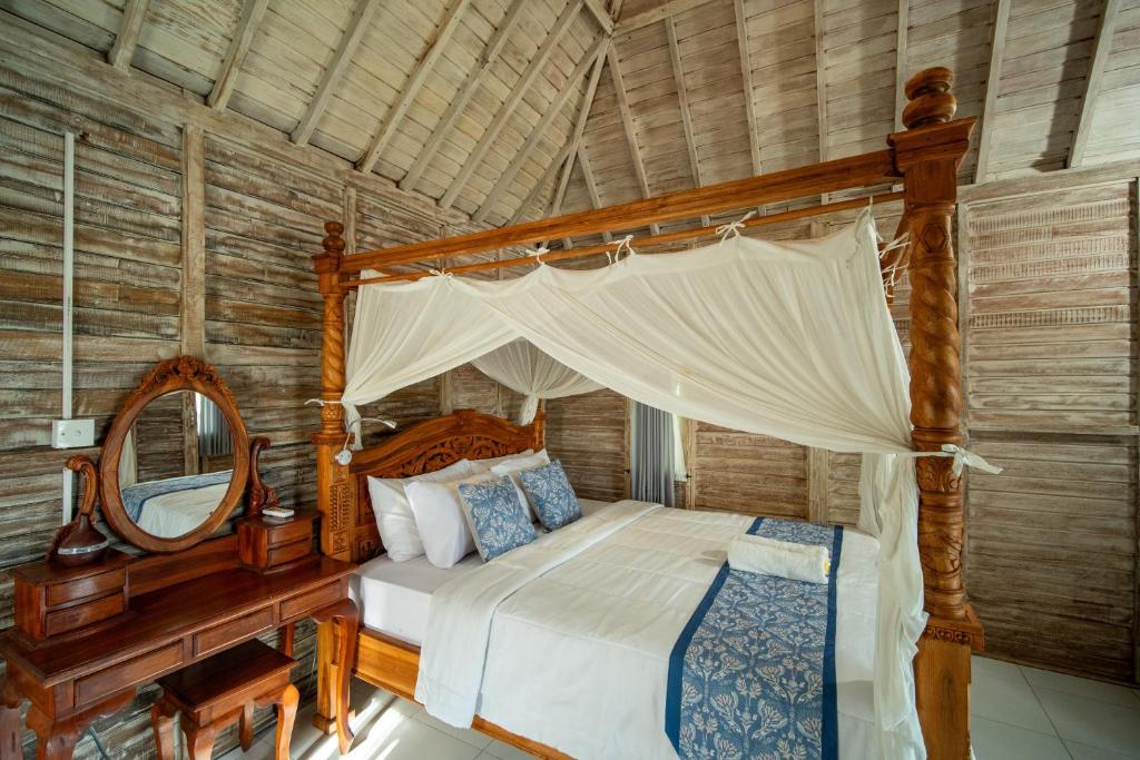 Postel nebo postele na pokoji v ubytování Kubu Sari Ubud